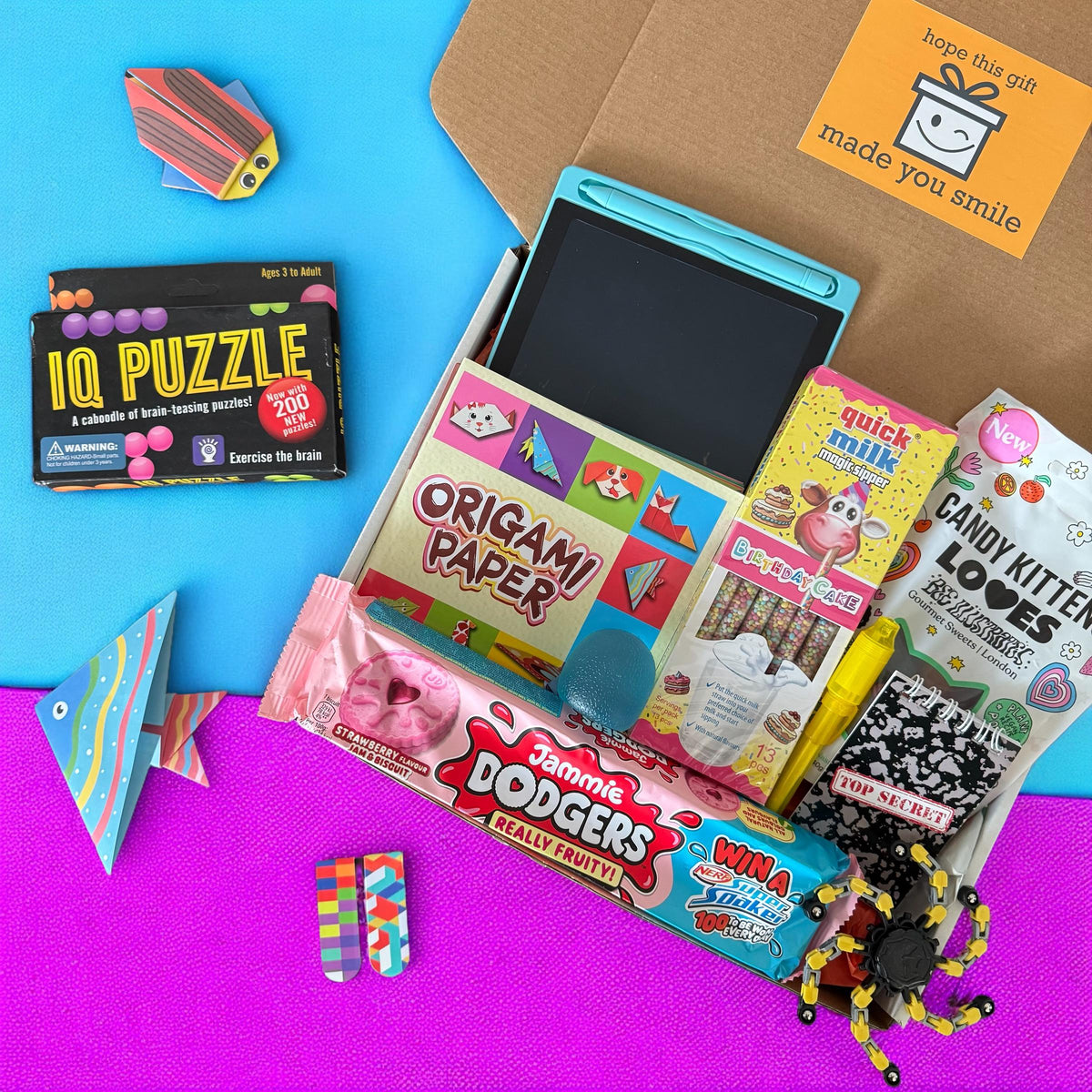 Assorted toys and games including a puzzle, origami paper, and candy on a colorful background.